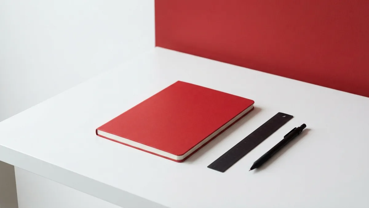 GA4 data stream setup concept Crimson notebook and graphite tools representing a GA4 data stream setup