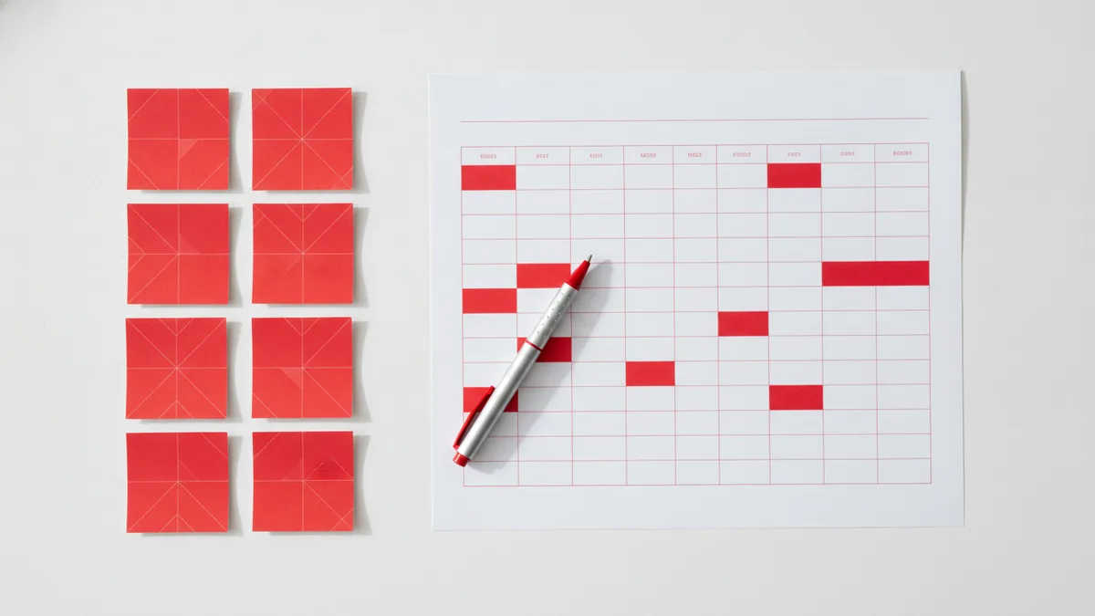 Map one topic per page Keyword research notes mapped to page topics on a desk